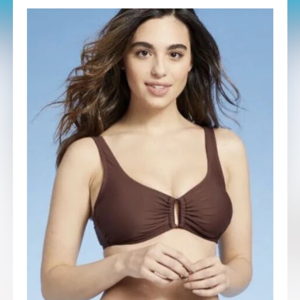 Brown bikini top with embellishment in the middle